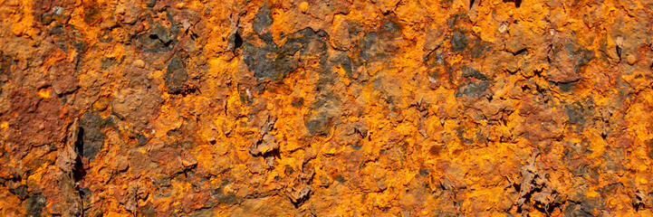 Rust of metals.Corrosive Rust on old iron with a hole. Rusted orange painted metal wall. Rusty metal background with streaks of rust. Old shabby paint.metal rust texture background