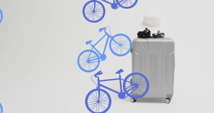 Animation of blue bicycle icons over baggage