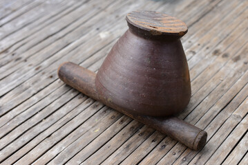 granite mortar with pestle on wood.