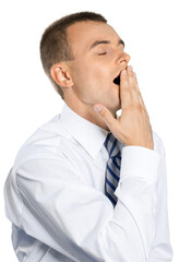 Tired Young Businessman Yawning and Covering his Mouth - Isolated