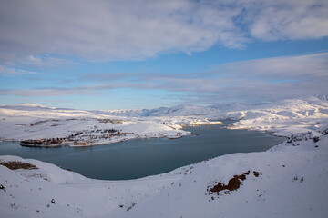 Fototapeta na wymiar Erzincan Province, İliç District with snowy landscapes, river and historical bridge