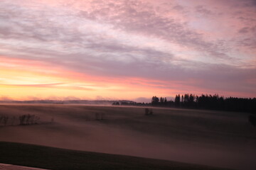 Fototapeta na wymiar scenic landscape in the morning with fog and sunrise