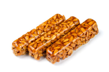 Kozinaki on a white background. Confectionery from seeds. Sweet kozinaki.