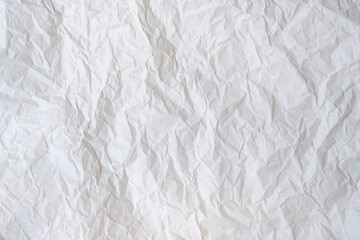 Fototapeta premium Wrinkled or crumpled white stencil paper or tissue after use in toilet or restroom with large copy space used for background texture in decorative art work