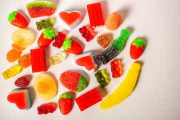 various types of assorted jelly candy on white background