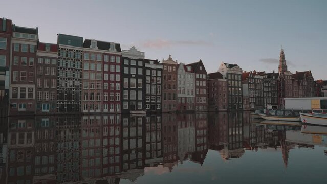 Amsterdam, Netherlands - Dancing Houses on Damrak Canal in the Morning