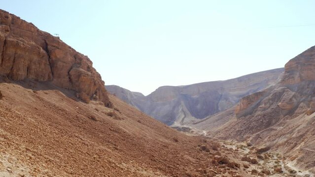 From Madaba to the Dead Sea in Jordan. Landscape of desert mountains with a beautiful cloudless sky.