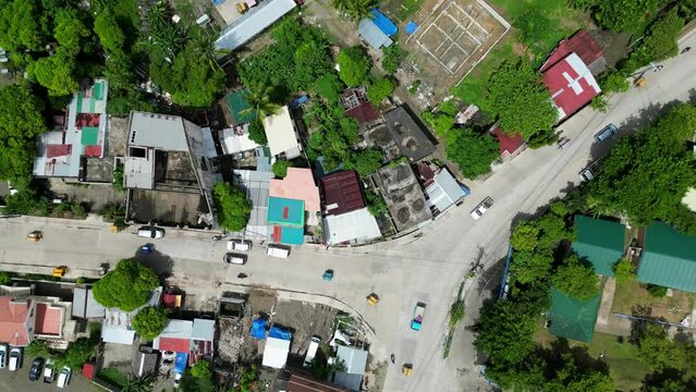 Bird's eye Top Down View of bustling three-way intersection in Philippine rural town.