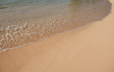Calm sea beach background. Summer tropical beach with sand. Ocean water. Natural seascape.