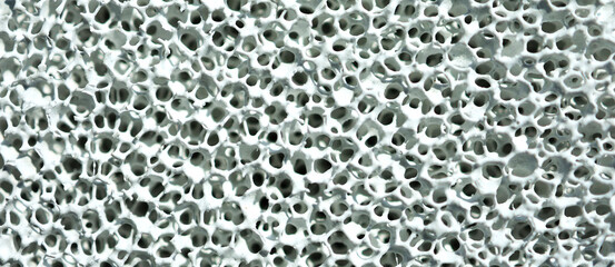 A close-up macro shot of a ceramic-coated sponge created by nanotechnology research to be used as a...