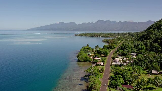 Stunning Aerial View of a Beachside Road in Tahiti and the Coral Reefs of Tahiti Iti