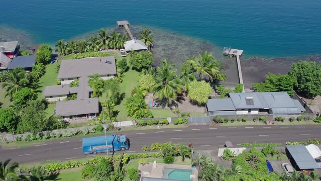Aerial View of Road and Beachfront Properties in Tahiti and the Coral Reefs of Tahiti Iti