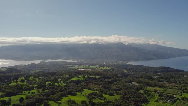 Slow Rising Aerial Drone Footage of Tahiti Island and Tahiti Iti from Mountain Top