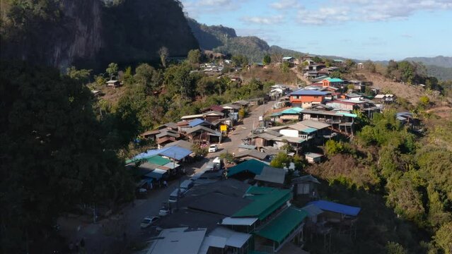 Aerial view over rural Thai village of Ban Jaa Bo in top of tropical mountains