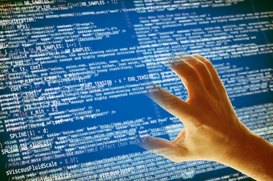 hand grabbing a computer code, malware and phishing attack concept
