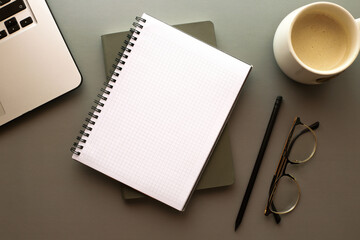 Fototapeta na wymiar Mockup notebook on the table. Freelancer is desktop. Back to school. Morning businessman