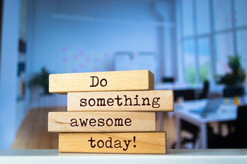 Wooden blocks with words 'Do something awesome today'.