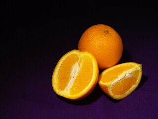 Juicy oranges on a dark background