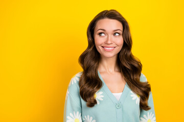 Fototapeta premium Portrait of cheerful nice person beaming smile look empty space blank isolated on yellow color background