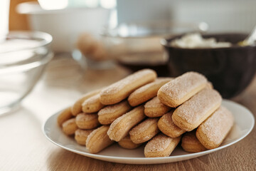 Ingredients for cooking tiramisu. Savoiardi biscuit cookies, mascarpone, cream, sugar