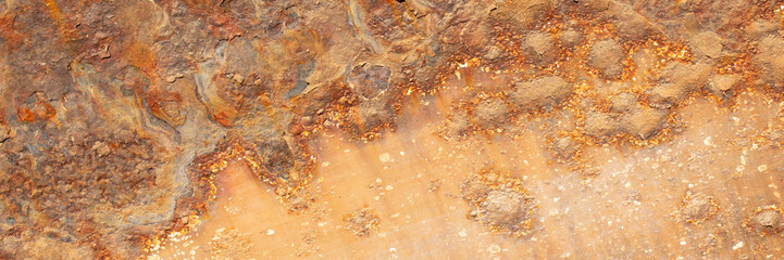 Rust of metals.Corrosive Rust on old iron with a hole. Rusted orange painted metal wall. Rusty metal background with streaks of rust. Old shabby paint.metal rust texture background