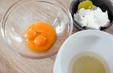 Ingredients for cooking tiramisu. Eggs, mascarpone, cream