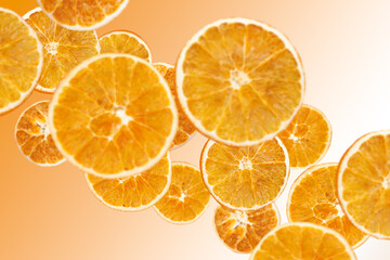 Fototapeta na wymiar Levitation of dry orange slices.