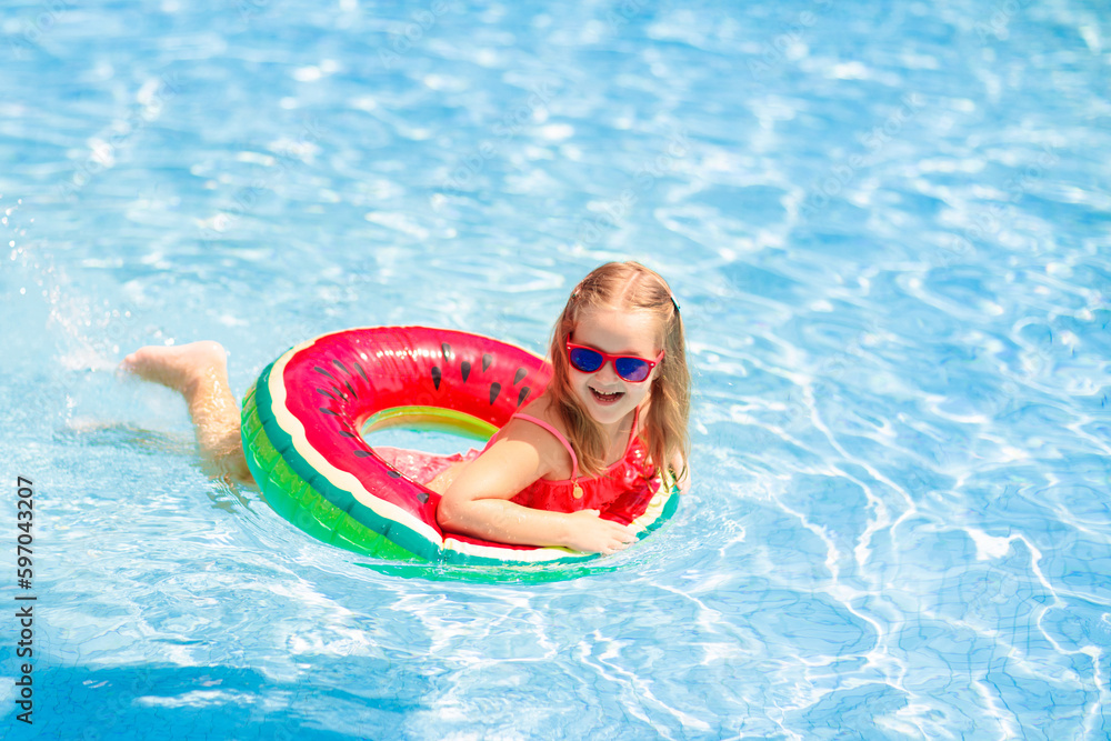 Wall mural Child in swimming pool. Kids swim. Water play.