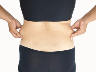 Cellulite in woman and she grabbing her waist around hip cause of fatty from weight. liposuction concept.