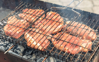 Barbecue with tasty grilled meat on grill, closeup. Barbeque party