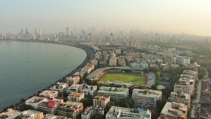 Mumbai: Aerial view of famous city in India at sunrise, modern city skyline with skyscrapers - landscape panorama of South Asia from above - Powered by Adobe