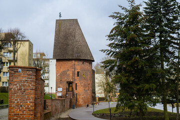 Round tower in the historic surrounding city wall of Slupsk, Poland. Witches tower - Baszta Czarownic in Slupsk. Sights of Poland. Old jail. Travel destination. Tourist attraction 