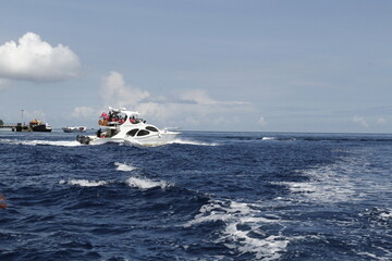 Fototapeta premium INDONESIA: A yacht crossing the waters near Bunaken in Manado at an event in November 2015