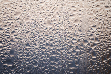 backlit drops on beige and blue background