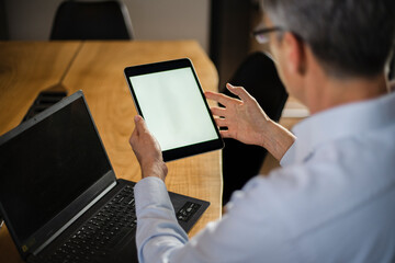 Close up of man using digital tablet.