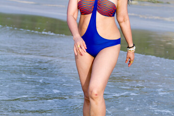 Woman with swimsuit walking show body big at beach Hat Wanakon National Park, Prachuap Khiri Khan Province in Thailand is famous for travel and relax
