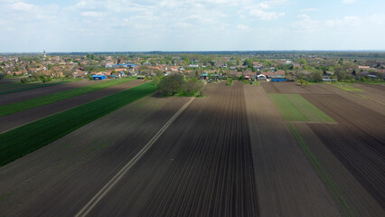 arable land and agricultural fields in the spring seen from above