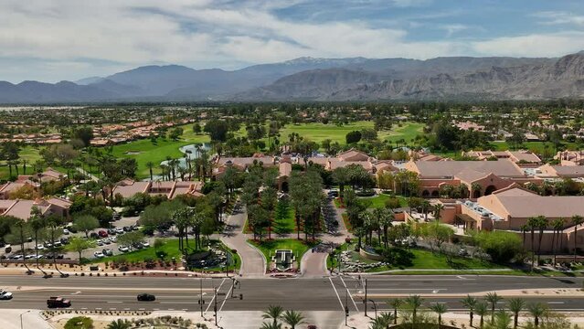 Low aerial view flying over the entrance of the Westin Rancho Mirage Golf Resort and Spa near Palm Springs California.
