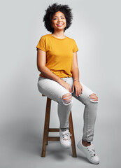 Portrait, smile and woman sitting on stool in studio isolated on a white background. Chair,...