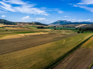 Fototapeta na wymiar Colfiorito, Umbria. Fields and crops. Play of colors seen from above.