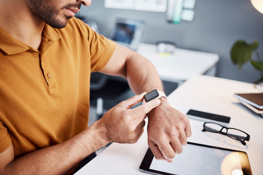 Time, notification and man with a watch at work for deadline, appointment or reading a message. Digital, technology and an employee with electronics for timing, organizer and connection in office