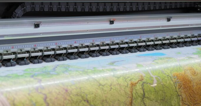 Modern Digital Large format UV printer. Printing production technologies. UV pinning is the process of applying a dose of low intensity ultraviolet light to a UV curable ink