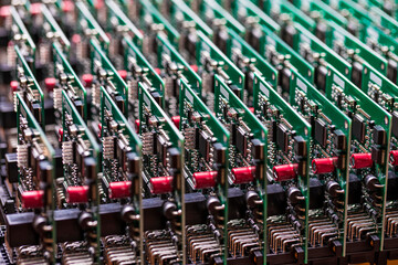 Fototapeta premium Electronic Production Ideas. Closeup View of Batch of Ready Automotive Printed Circuit Boards with Surface Mounted Components.