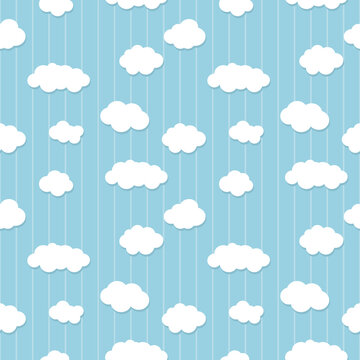 White clouds seamless pattern on a baby blue background