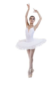 Professional Japanese Female Ballet Dancer Posing in White Tutu With Lifted Hands Against White