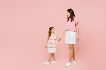 Full body side profile view cheerful fun woman wear casual clothes with child kid girl 6-7 years...