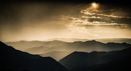 banner of mountain peaks in beautiful stormy sunset light