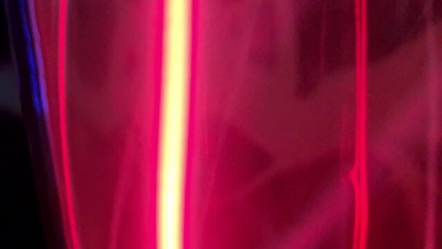 Inert gas krypton moves at lightning speed due to electricity. Red gas movement