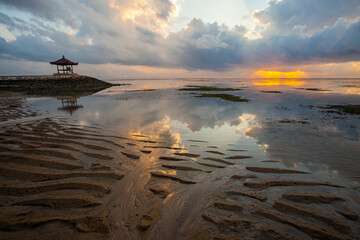 Beautiful, peaceful, and tranquil sunrise view in Sanur Beach, Bali, Indonesia. Sanur beach is a...