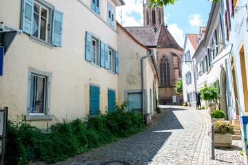 Fototapeta na wymiar Street with church in the old summer city.